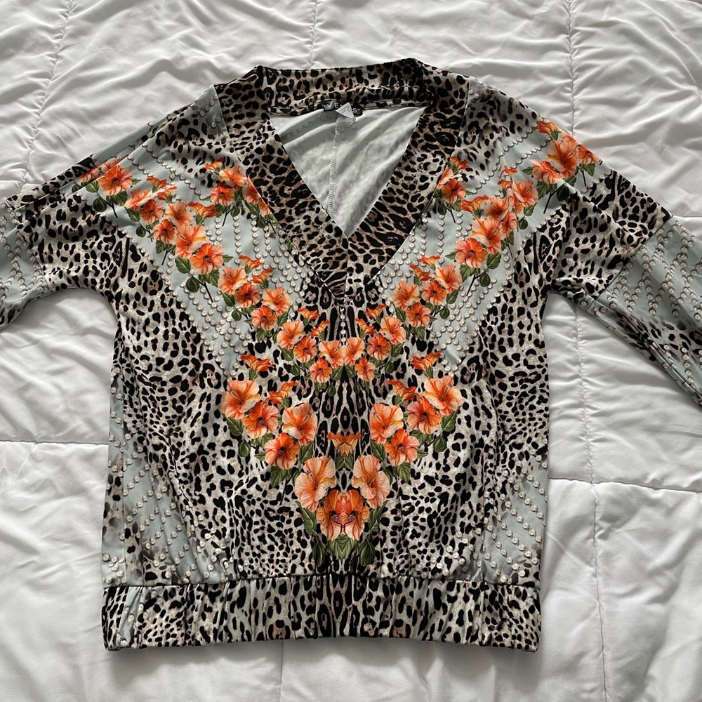 Women’s top size XS with leopard accent print